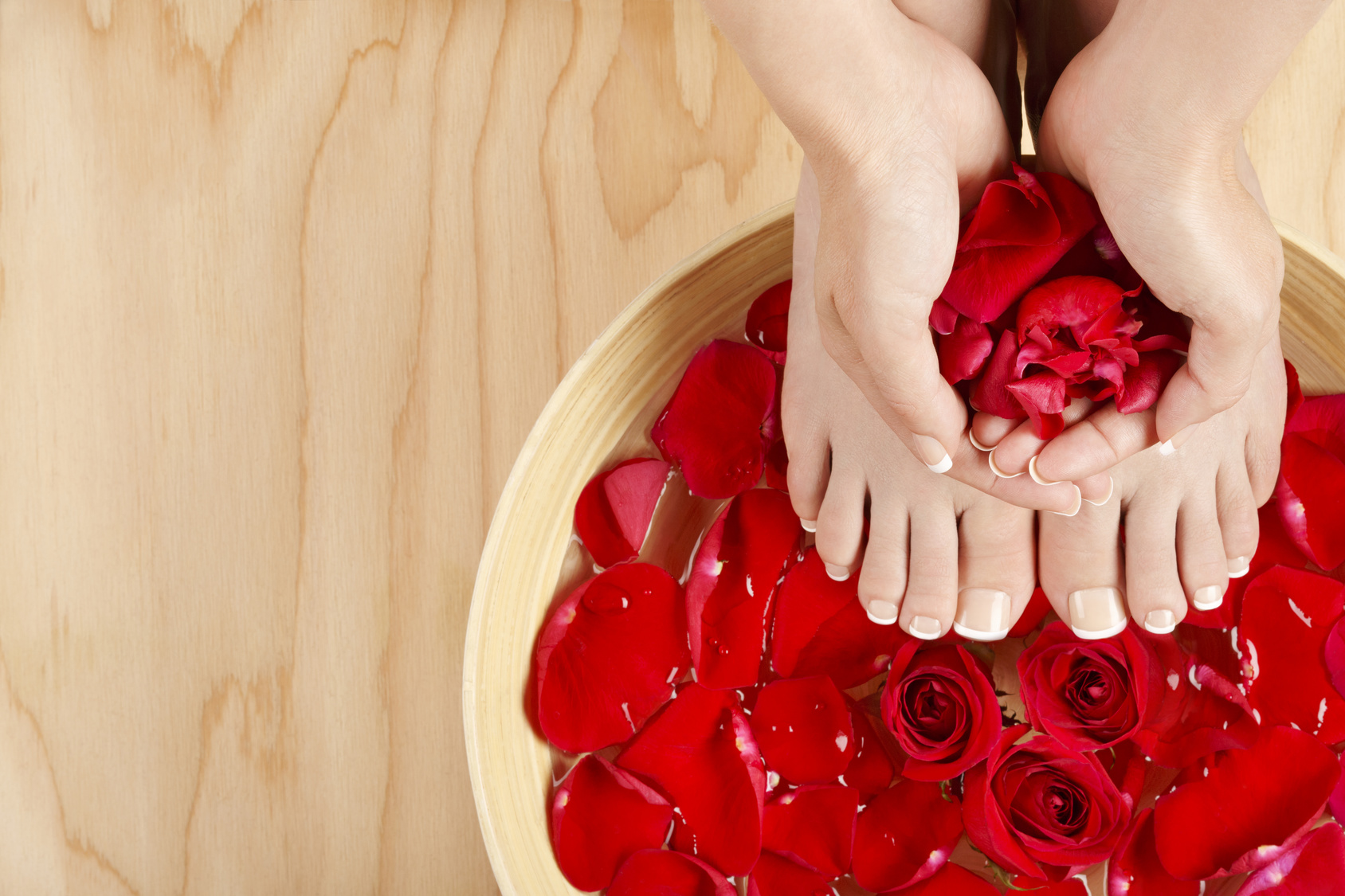 Pedicure Manicure Spa Treatment with Red Roses Wood Background